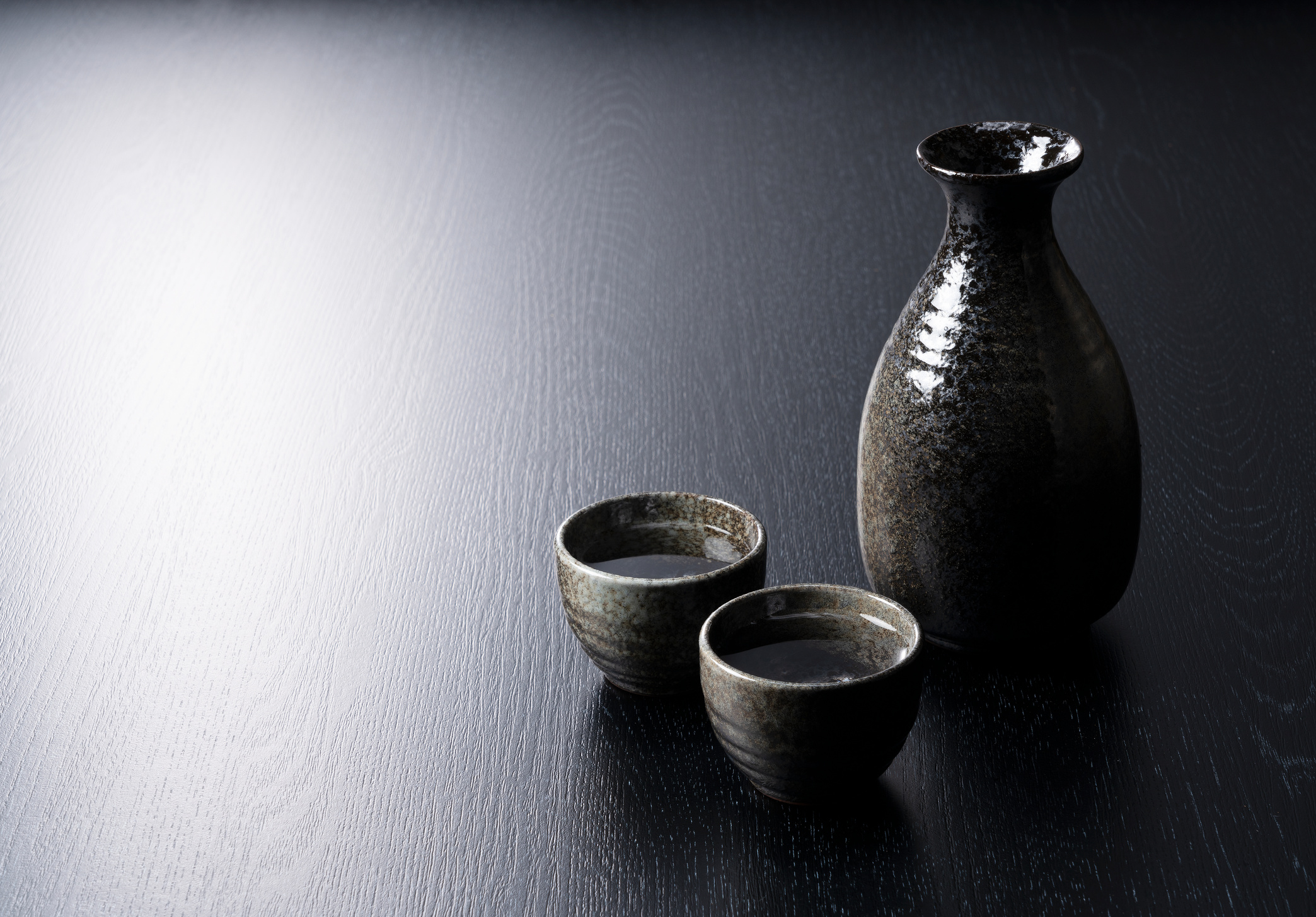 Sake Containers on a Black Background